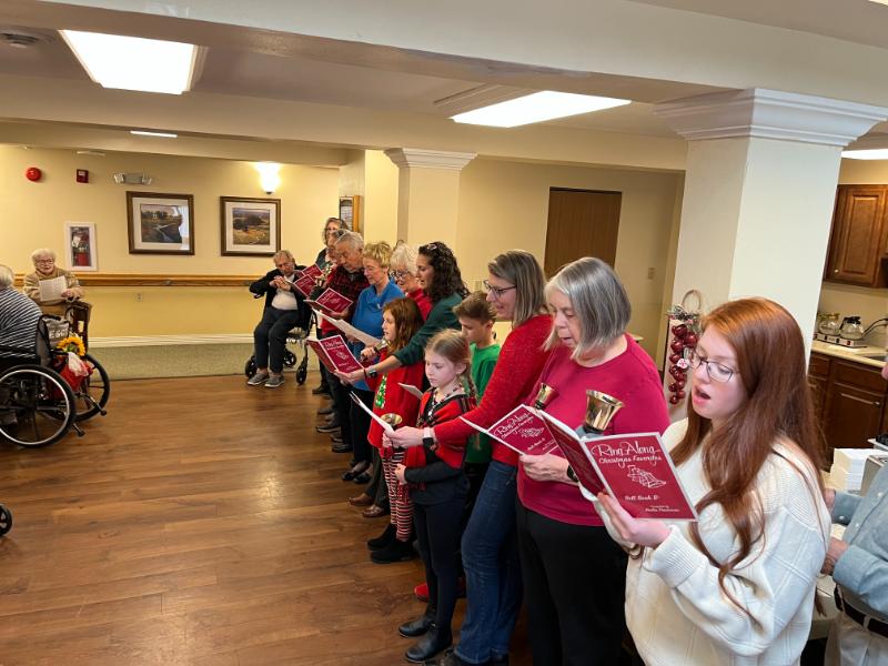 Immanuel United Methodist Church members singing to the residents.